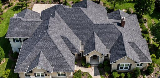 Complex roof with many sections, valleys, and dormers